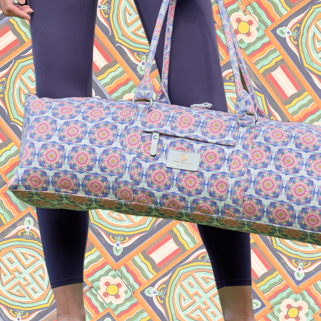 M44space-A yogi stands with a tote-style yoga bag in front of an oriental-inspired wall